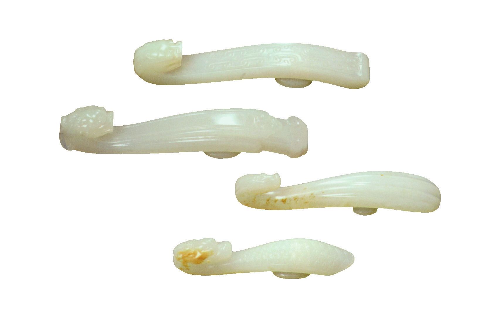 白玉雕龙钩（一组四件） 【清代】从上到下分别长9.8厘米；长9.3厘米；长7.8厘米；长6.8厘米